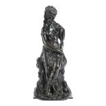 A FRENCH BRONZE FIGURE OF A SCANTILY CLAD MAIDEN LATE 19TH CENTURY seated on a rocky outcrop,