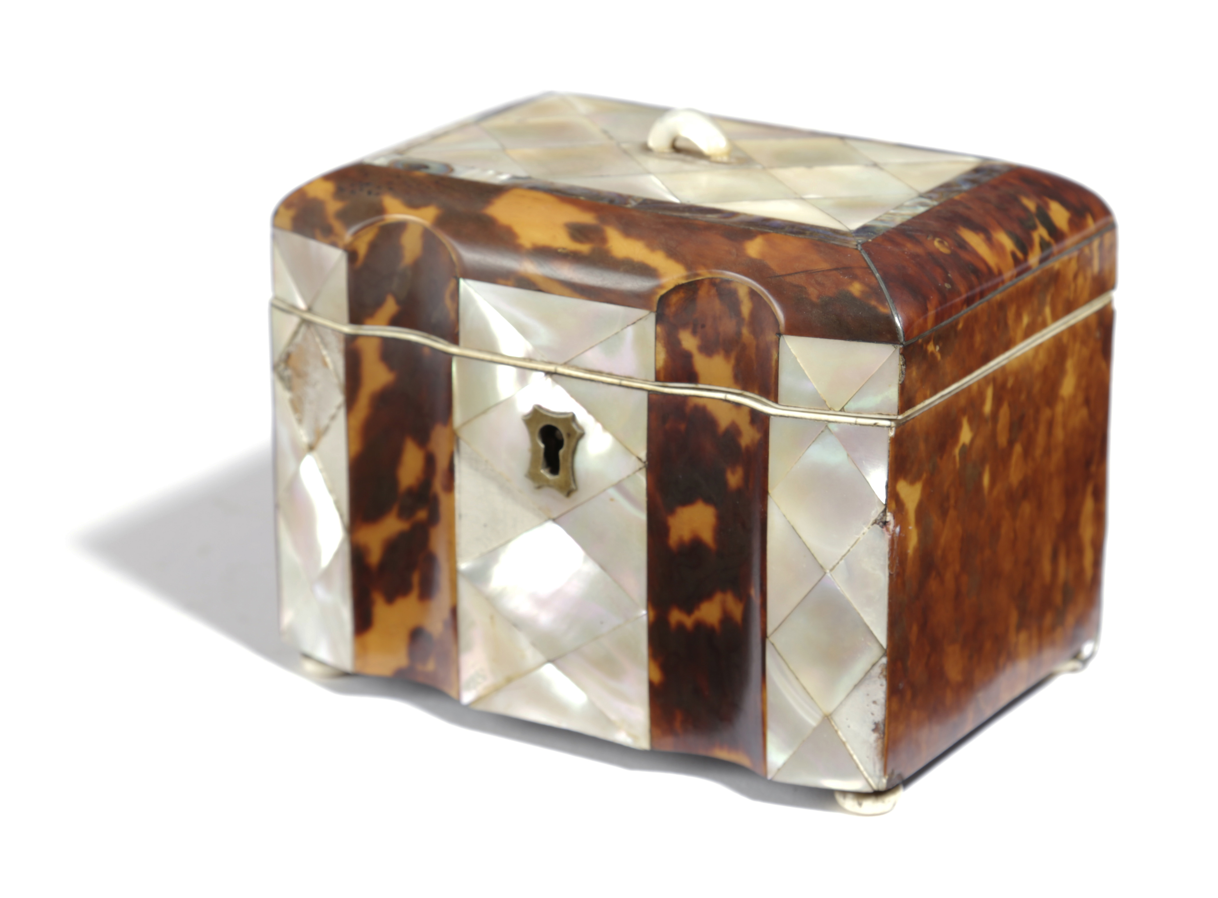 A REGENCY TORTOISESHELL AND MOTHER OF PEARL TEA CADDY EARLY 19TH CENTURY of shaped rectangular form,
