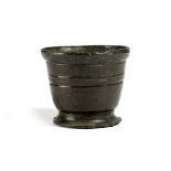 A BRONZE MORTAR POSSIBLY 15TH / 16TH CENTURY the slightly rounded body with banded decoration and