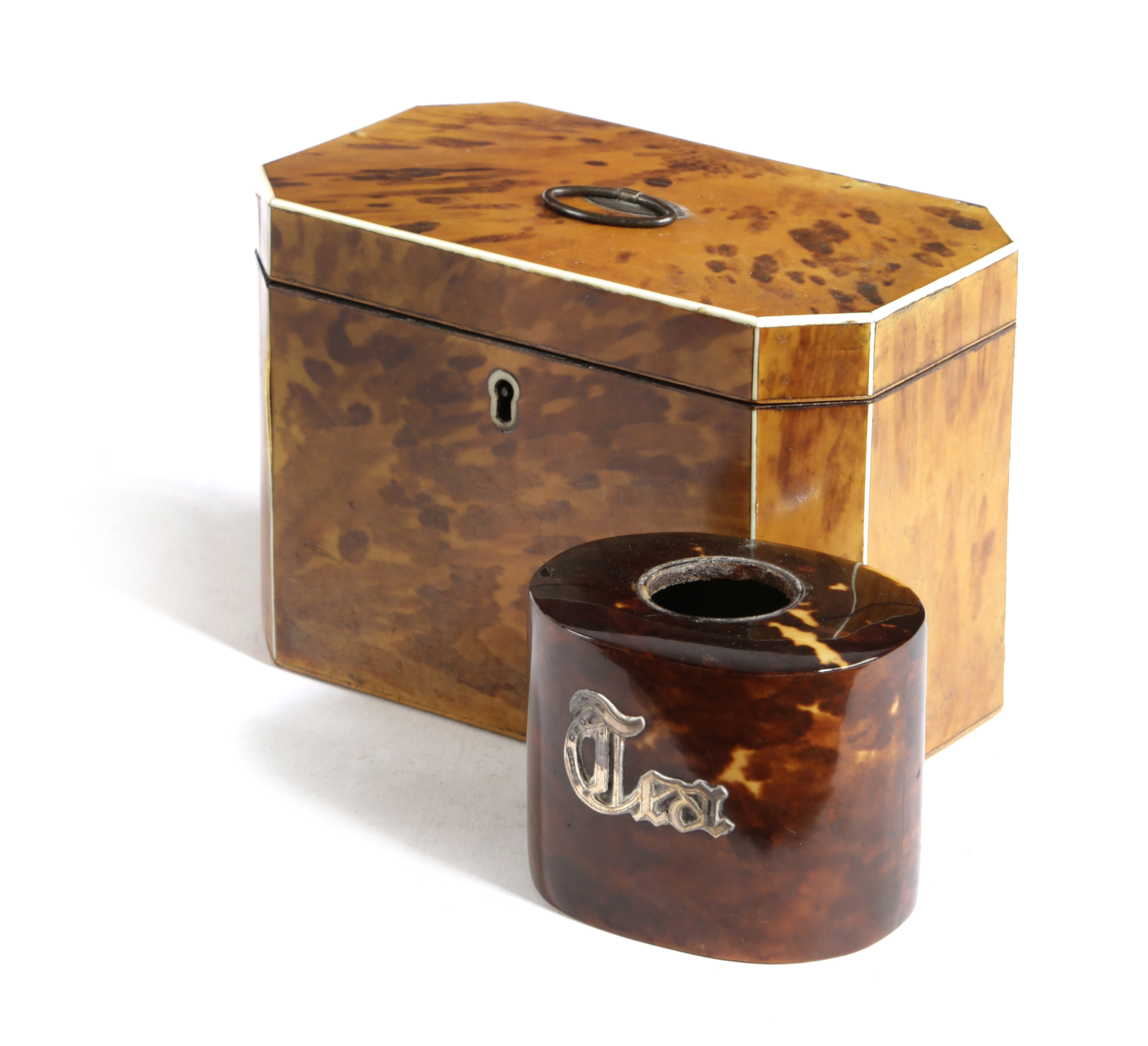 A LATE GEORGE III BLONDE TORTOISESHELL TEA CADDY C.1800 of canted rectangular form with ivory