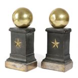 A PAIR OF PATINATED BRASS DOORSTOPS IN EMPIRE STYLE, 19TH CENTURY modelled as a large sphere on a