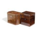 A GEORGE III MAHOGANY TEA CADDY C.1800 with bowed ends, the cover inlaid with a shell motif and