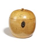 A TREEN FRUITWOOD TEA CADDY IN THE FORM OF AN APPLE EARLY 19TH CENTURY with a stalk finial,