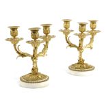 A PAIR OF FRENCH ORMOLU AND WHITE MARBLE THREE LIGHT CANDELABRA IN LOUIS XVI STYLE, LATE 19TH