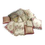 A COLLECTION OF CUSHIONS 18TH CENTURY AND LATER comprising: five pairs, some with Aubusson