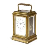 A FRENCH GILT BRASS CARRIAGE CLOCK RETAILED BY W. BENSON, LTD, LONDON the brass eight day movement