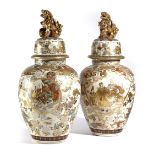A PAIR OF JAPANESE SATSUMA VASES AND COVERS LATE 19TH CENTURY each of ovoid form and decorated