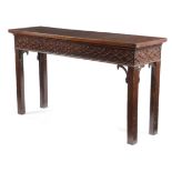 A GEORGE III MAHOGANY SERVING TABLE C. 1770 with a blind fretwork frieze above chamfered legs with