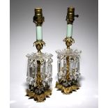 A PAIR OF FRENCH GILT BRONZE LUSTRE CANDLESTICKS 19TH CENTURY each with a glass drip-tray and