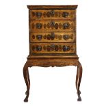 A LABURNUM OYSTER VENEERED CHEST ON STAND EARLY 18TH CENTURY ELEMENTS AND LATER with four long