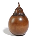 A TREEN FRUITWOOD TEA CADDY IN THE FORM OF AN AUBERGINE 20TH CENTURY with a screw-off calyx and