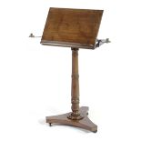 A GEORGE IV MAHOGANY MUSIC STAND C.1825-30 the hinged top on a ratchet and fitted with a rest,