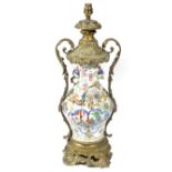 A CHINESE CANTON PORCELAIN AND ORMOLU MOUNTED TABLE LAMP 19TH CENTURY the vase decorated in the