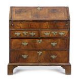 A GEORGE I WALNUT BUREAU BY JOHN GATEHOUSE (ACTIVE 1700-1730) with cross and feather banding, the