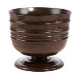 A CHARLES II TREEN LIGNUM VITAE WASSAIL BOWL C.1680 the body with moulded banding on a short stem