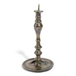 A EUROPEAN BRASS PRICKET CANDLESTICK VENETIAN OR GERMAN, C.1550 the spike on a slender stem with