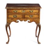 A WALNUT LOWBOY EARLY 18TH CENTURY AND LATER with cross and feather banding, with one long and two