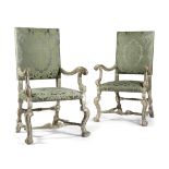 A PAIR OF PAINTED AND SILVERED OPEN ARMCHAIRS ONE C.1700, ONE A LATER COPY each with a padded back