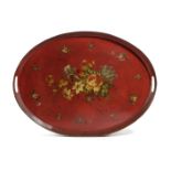 A TOLE PEINTE OVAL TRAY C.1820-40 painted with a large floral spray and smaller sprigs inside a