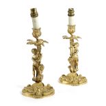 A PAIR OF FRENCH ORMOLU CANDLESTICKS OF LOUIS XV STYLE, LATE 19TH CENTURY each modelled as a boy