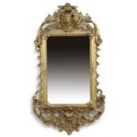 A GILTWOOD AND GESSO PIER MIRROR IN GEORGE II STYLE, 19TH CENTURY the later plate beneath a