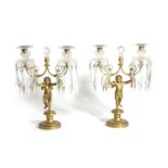 A PAIR OF REGENCY GILT METAL FIGURAL CANDELABRA EARLY 19TH CENTURY the pair of cut-glass sconces