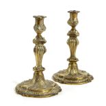 A PAIR OF FRENCH GILT BRONZE CANDLESTICKS IN LOUIS XV STYLE, 19TH CENTURY the sconces decorated with