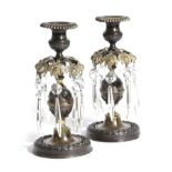 A PAIR OF REGENCY GILT AND PATINATED BRONZE CANDLESTICKS EARLY 19TH CENTURY with a gadrooned