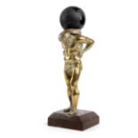 A BRASS FIGURE OF ATLAS AFTER THE ANTIQUE standing, with a later model of Earth on his shoulders