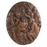 A FLEMISH OVAL OAK PANEL DEPICTING THE MOCKING OF CHRIST 17TH CENTURY carved with Christ seated with