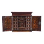 AN ITALIAN CEDAR AND POKERWORK TABLE CABINET ADIGE, 17TH CENTURY AND LATER with a pair of hinged