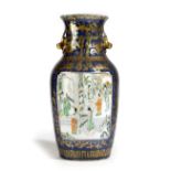 A CHINESE PORCELAIN FAMILLE VERTE VASE 19TH CENTURY of baluster form, painted with a scholar and