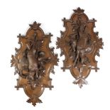 A PAIR OF BLACK FOREST LINDEN WOOD HUNTING TROPHY PLAQUES LATE 19TH CENTURY carved with a deer,