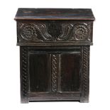 AN OAK BIBLE BOX LATE 17TH CENTURY the front carved with scrolling leaves and flowerheads with