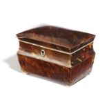 A REGENCY BLONDE TORTOISESHELL TEA CADDY EARLY 19TH CENTURY of shaped rectangular form, with a