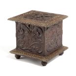 AN OAK BOX AND COVER DATED '1773' of square form, the cover carved with four doves inside foliage,