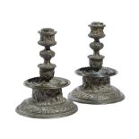 A PAIR OF ITALIAN BRONZE CANDLESTICKS IN RENAISSANCE STYLE AFTER A DESIGN ATTRIBUTED TO GASPARO