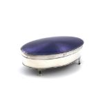 A silver and enamel dressing table box, by the Adie Brothers, Birmingham 1927, oval form, the hinged