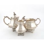 λA three-piece Victorian silver tea set, by The Barnards, London 1853/54, panelled baluster form,