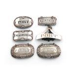 A collection of six antique silver wine labels, comprising: one incised 'MADEIRA' by William