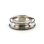 Designed by Harald Nielson for Georg Jensen, a Danish christening bowl and stand, design number 456,
