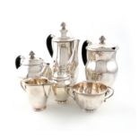 By Georg Jensen, a Danish matched five-piece silver tea and coffee set and a sugar caster, design
