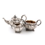 λA three-piece Victorian silver tea set, by John Tapley, London 1838/40, lobed tapering circular