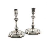 A pair of modern cast silver candlesticks, maker's mark of LW, London 1969, knopped tapering