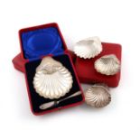 A collection of six antique silver shell butter dishes, comprising: three individually cased