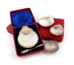 A collection of six antique silver shell butter dishes, comprising: three individually cased