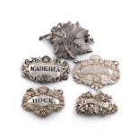 A collection of five silver wine labels, comprising: one pierced 'HOCK', with foliate and shell