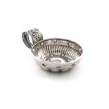 A French silver wine taster, circular form, fluted ring handle with a grapevine, the bowl with