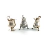 A small collection of three George II / III silver cream jugs, including: by George Campar, London