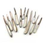 A collection of eleven silver and mother-of-pearl handled folding fruit knives, various dates and